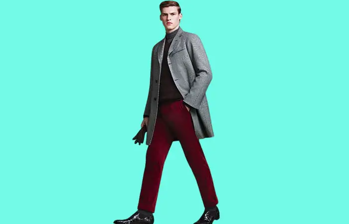 Maroon pants with a black turtleneck and gray overcoat