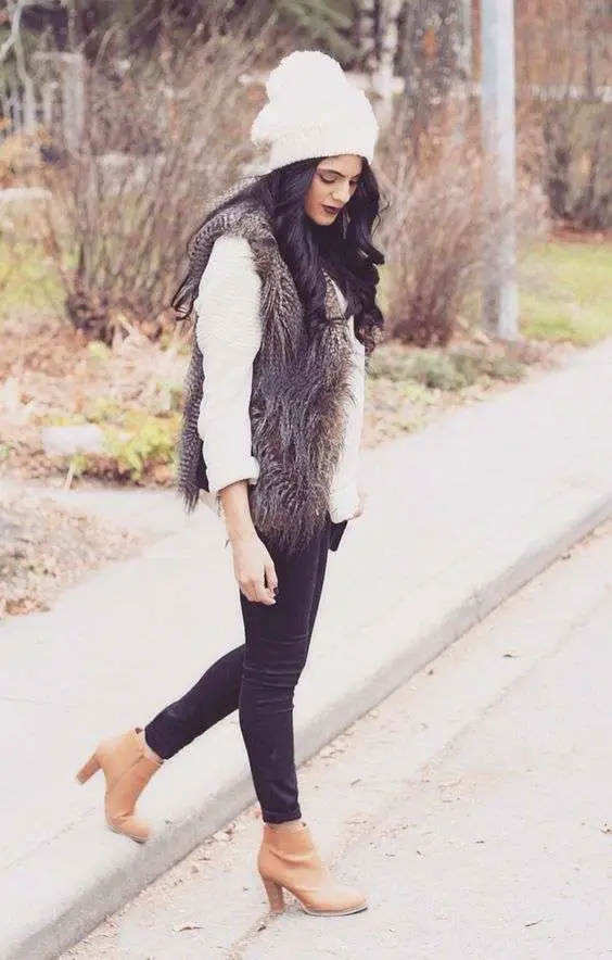 How to style black jeans with brown boots?  Faux Fur Vest With Black Jeans And Brown Boots